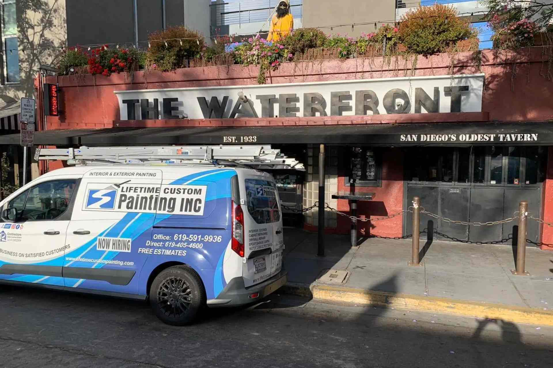 Lifetime Custom Painting Inc. van parked in front of a popular San Diego eatery, The Waterfront.